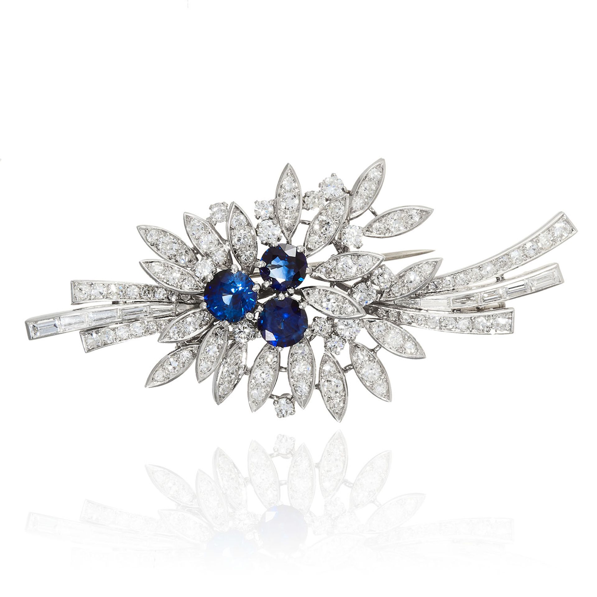 A DIAMOND AND SAPPHIRE BROOCH in white gold or platinum, the body formed of leaf and ribbon