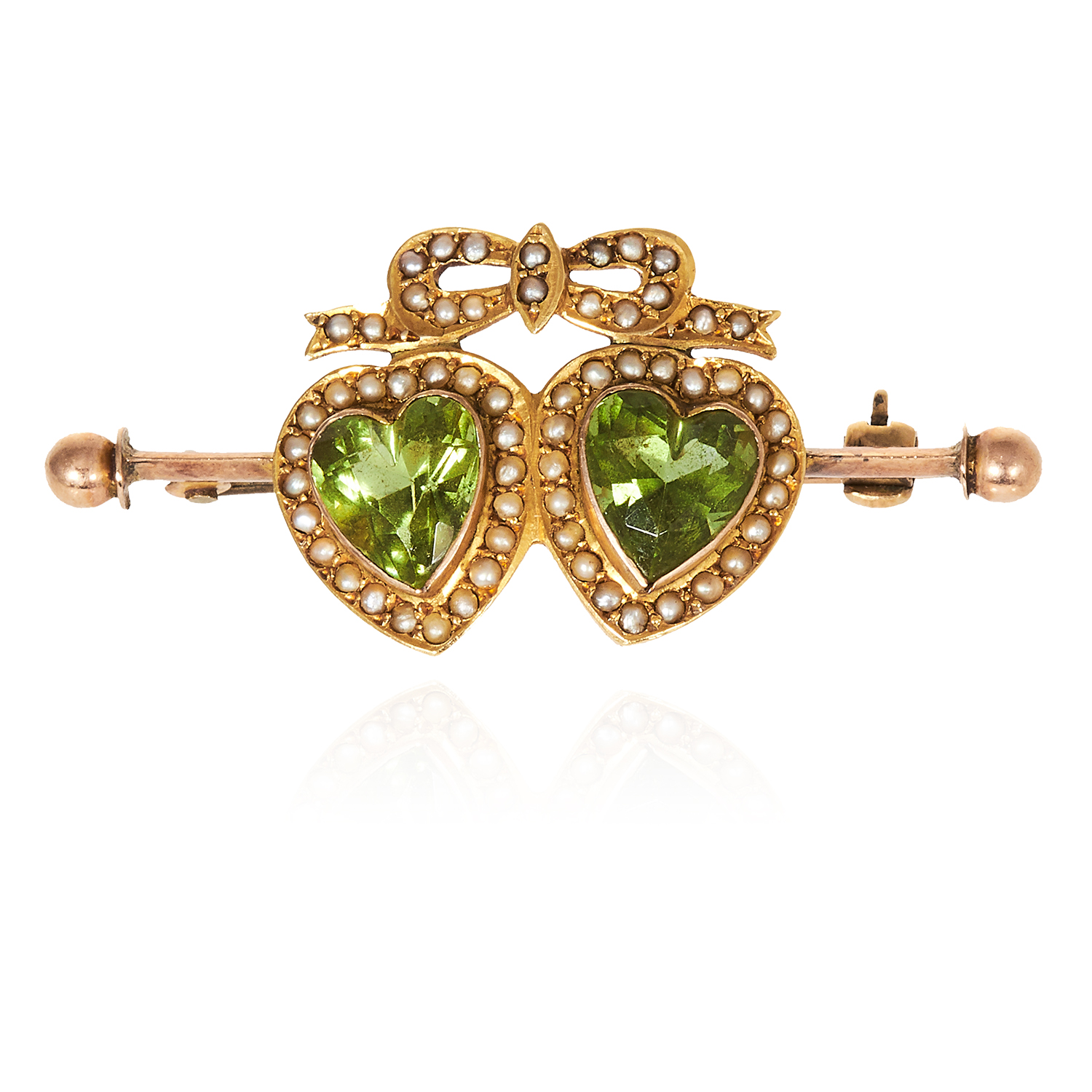 AN ANTIQUE PEARL AND PERIDOT SWEETHEART BROOCH in yellow gold, with ribbon and bow motif jewelled