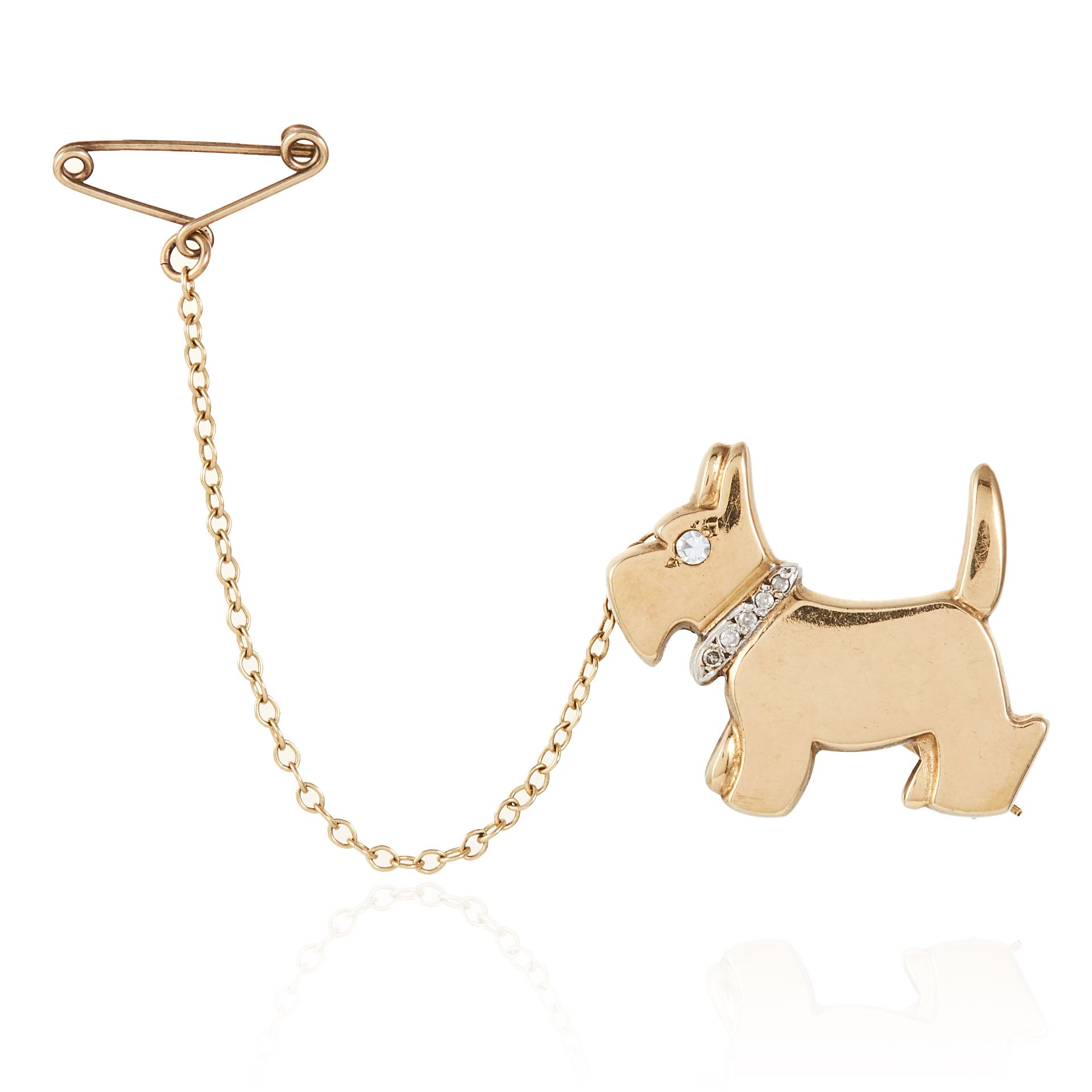 A DIAMOND SCOTTIE DOG BROOCH in yellow gold, designed as a Scottish terrier with diamond jewelled