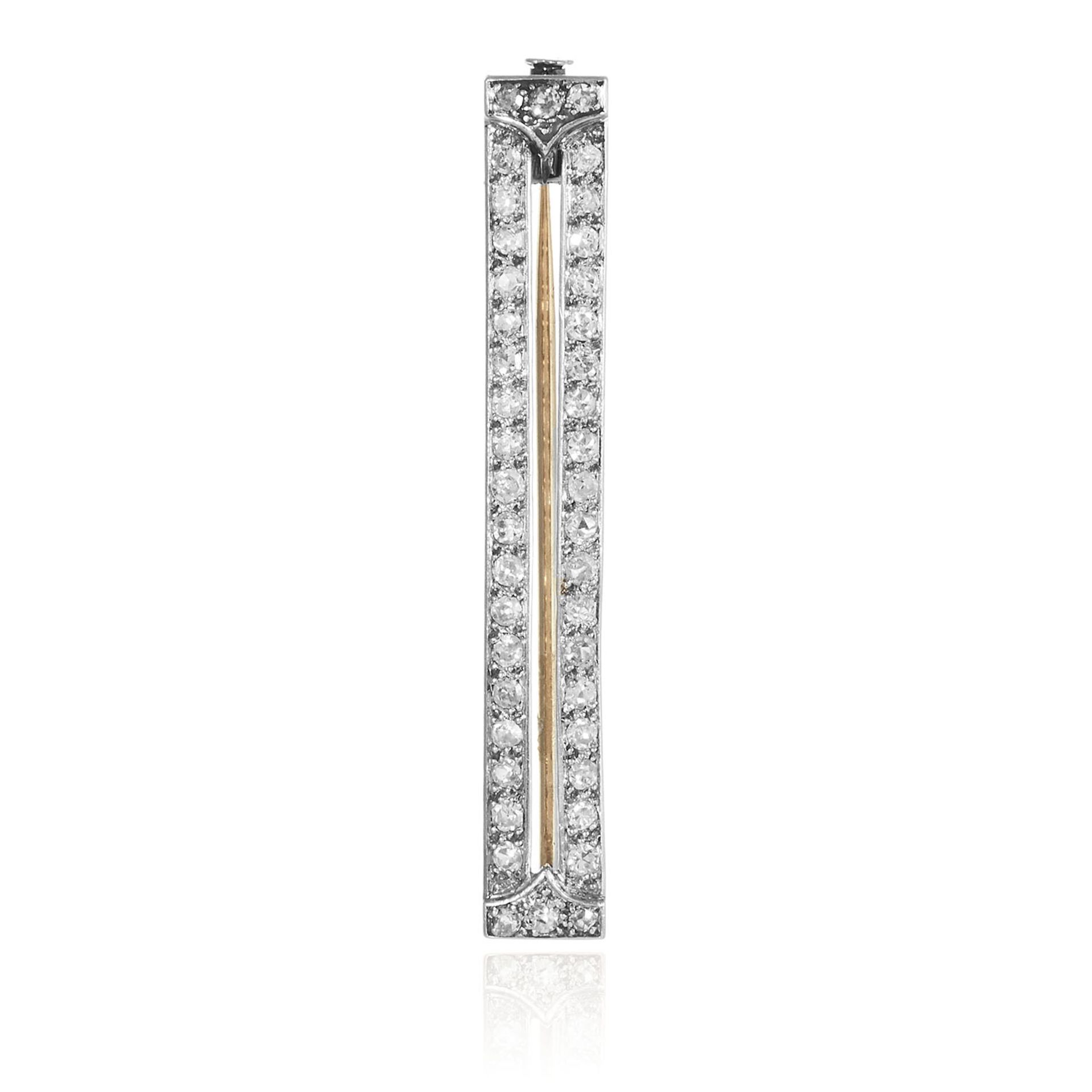 A DIAMOND BAR BROOCH in gold or platinum, designed as double row of round cut diamonds totalling