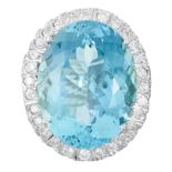 AN AQUAMARINE AND DIAMOND RING in white gold or platinum, set with an oval cut aquamarine of 27.50