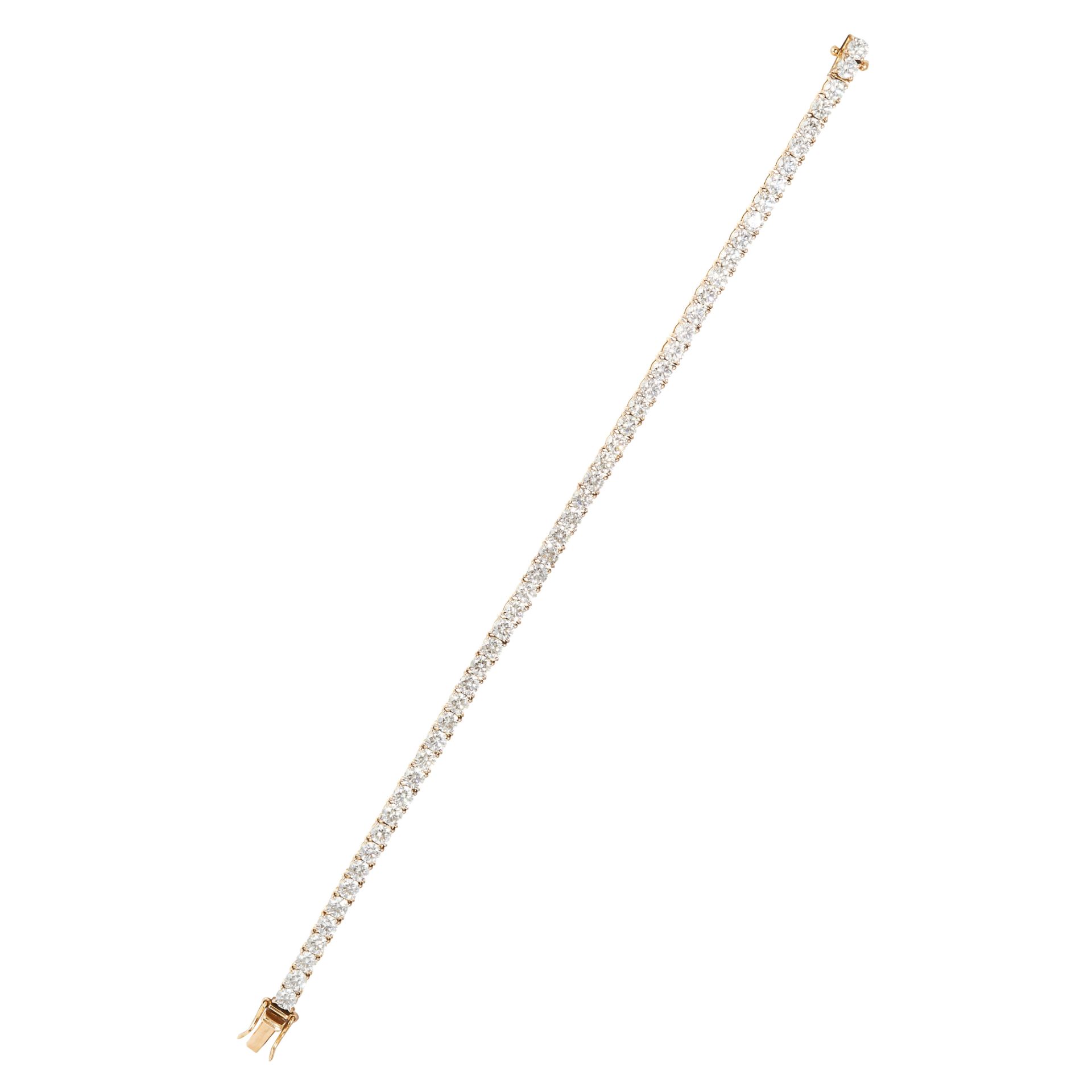 AN 8.53 CARAT DIAMOND LINE BRACELET in 18ct yellow gold, comprising of fifty round cut diamonds