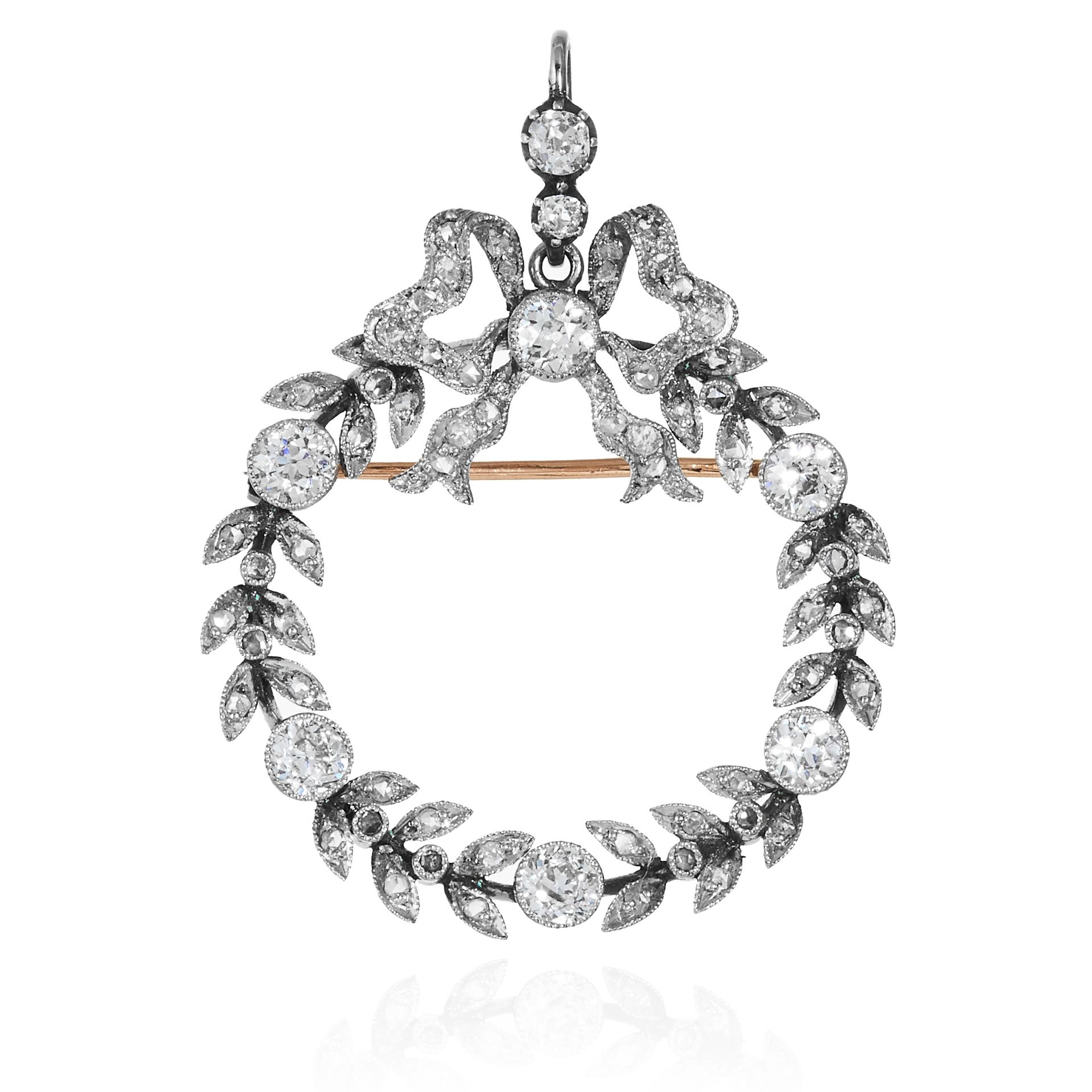 AN ANTIQUE DIAMOND WREATH BROOCH / PENDANT in gold or platinum, comprising of ribbon and foliate