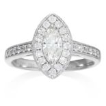 A DIAMOND DRESS RING in 18ct white gold, comprising of a central marquise cut diamond, framed in a