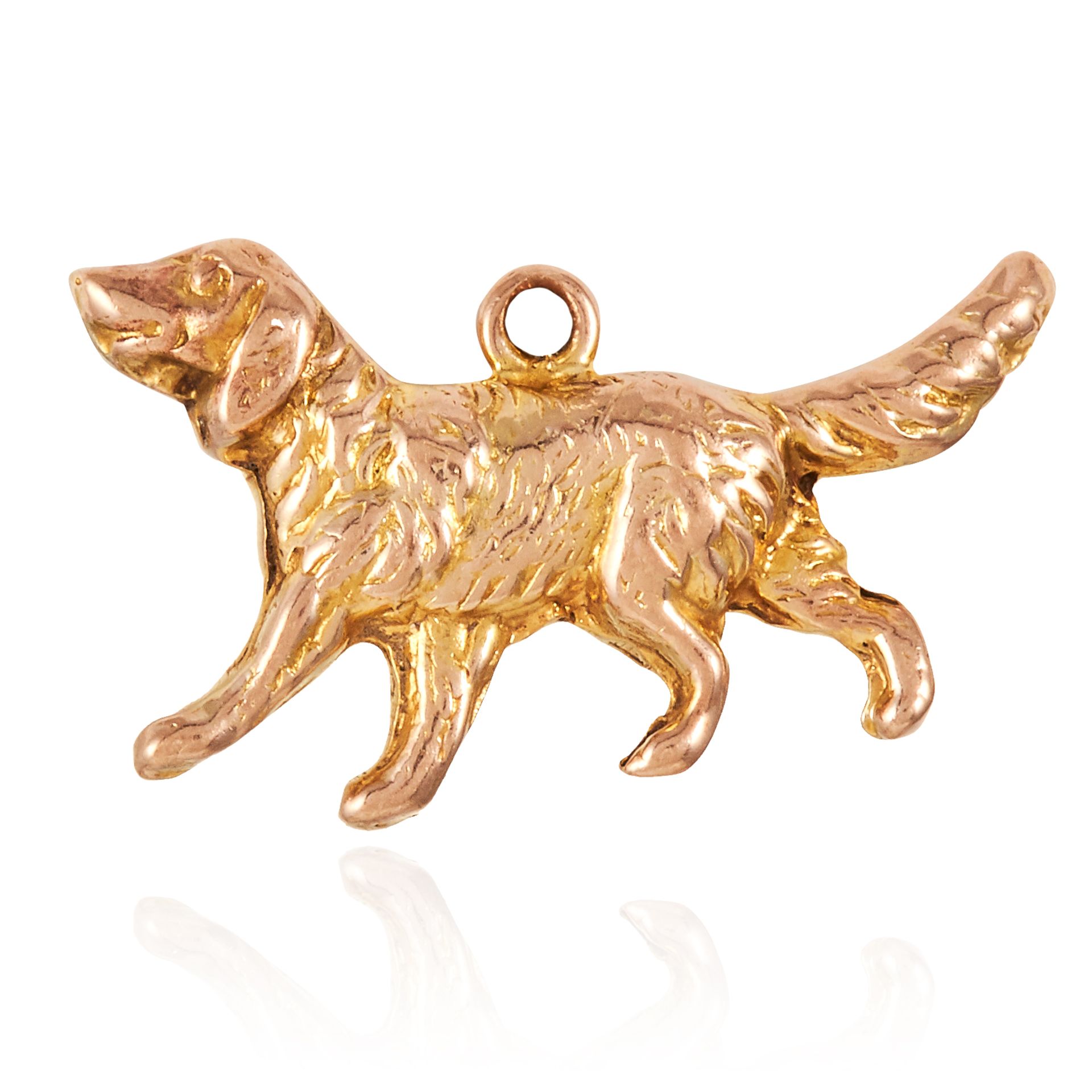 A GOLD DOG CHARM in 9ct yellow gold, designed as a hound in motion, stamped 9ct, 1.9cm, 0.6g.