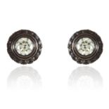 A PAIR OF DAY AND NIGHT DIAMOND EAR STUDS in 18ct gold, comprising of round cut diamond studs