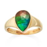 AN AMMOLITE DRESS RING in 14ct yellow gold, jewelled with a pear cut ammolite, stamped 14K, size P /