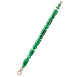 A JADE BRACELET comprising of twenty five polished jade beads, 21cm, 42.8g.