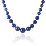 A LAPIS LAZULI AND GOLD BEAD NECKLACE in yellow gold, comprising a row of fifty-three polished,