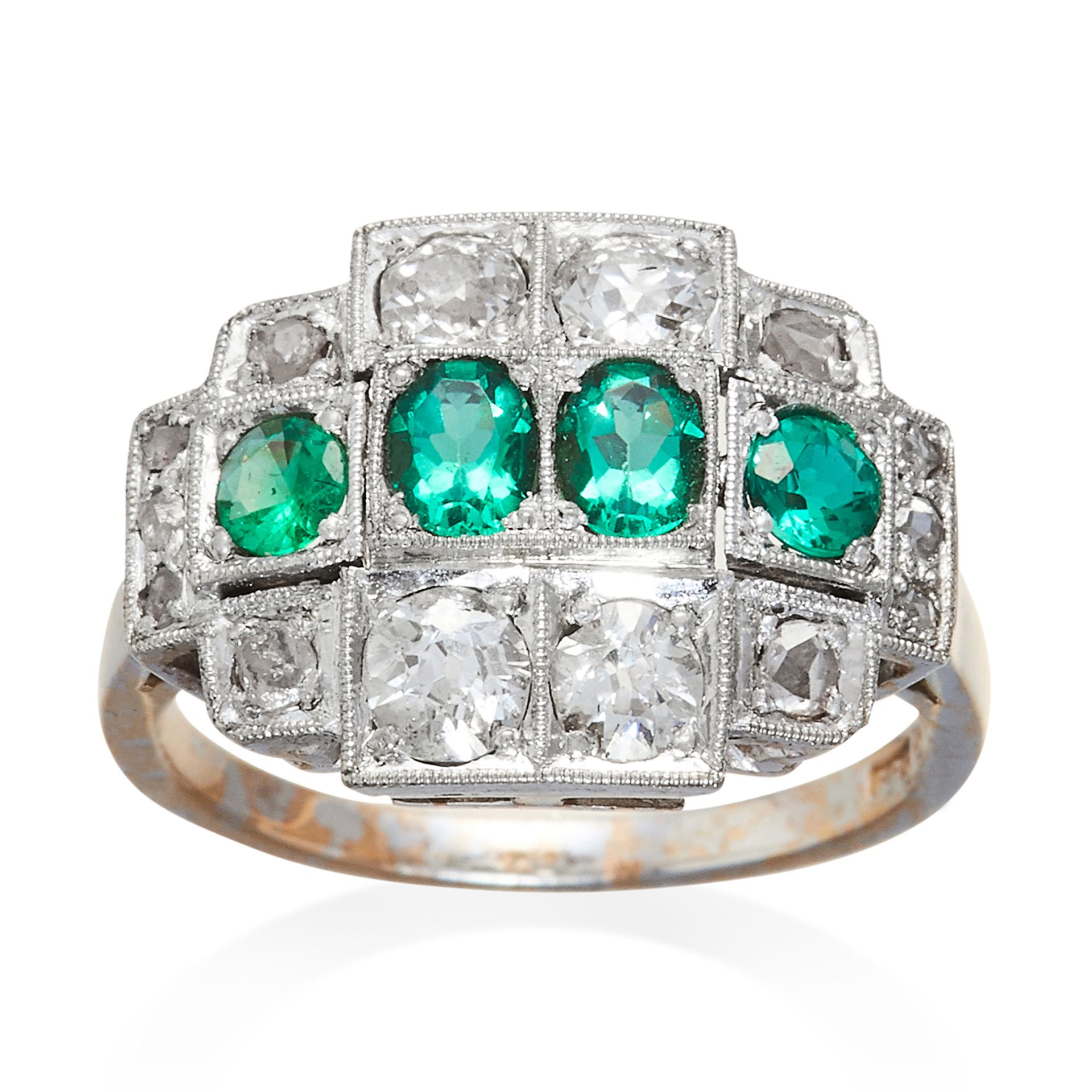 AN ANTIQUE EMERALD AND DIAMOND RING in white gold, four oval cut emeralds accented by round and rose