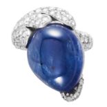 A SAPPHIRE AND DIAMOND DRESS RING in 18ct gold, the abstract design set with a cabochon sapphire
