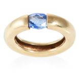 A SAPPHIRE DRESS RING in high carat yellow gold, the band suspending an oval cut sapphire, unmarked,