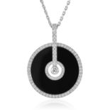 A 'LIMELIGHT PARTY' DIAMOND AND ONYX PENDANT, PIAGET in 18ct white gold, the circular polished