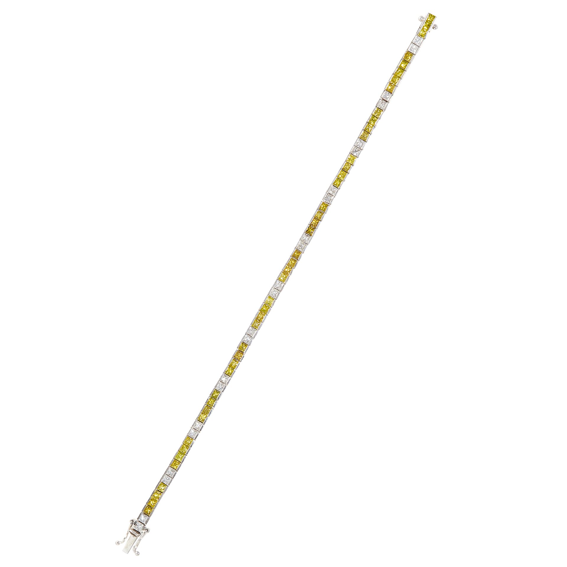 A 6.40 CARAT YELLOW AND WHITE DIAMOND LINE BRACELET in 18ct white gold, designed as alternating