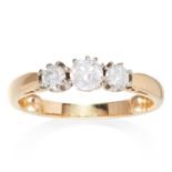 A DIAMOND THREE STONE RING in 18ct yellow gold, set with three diamonds totalling approximately 0.76