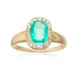 AN EMERALD RING in high carat yellow gold, set with an emerald cut emerald encircled with rose cut