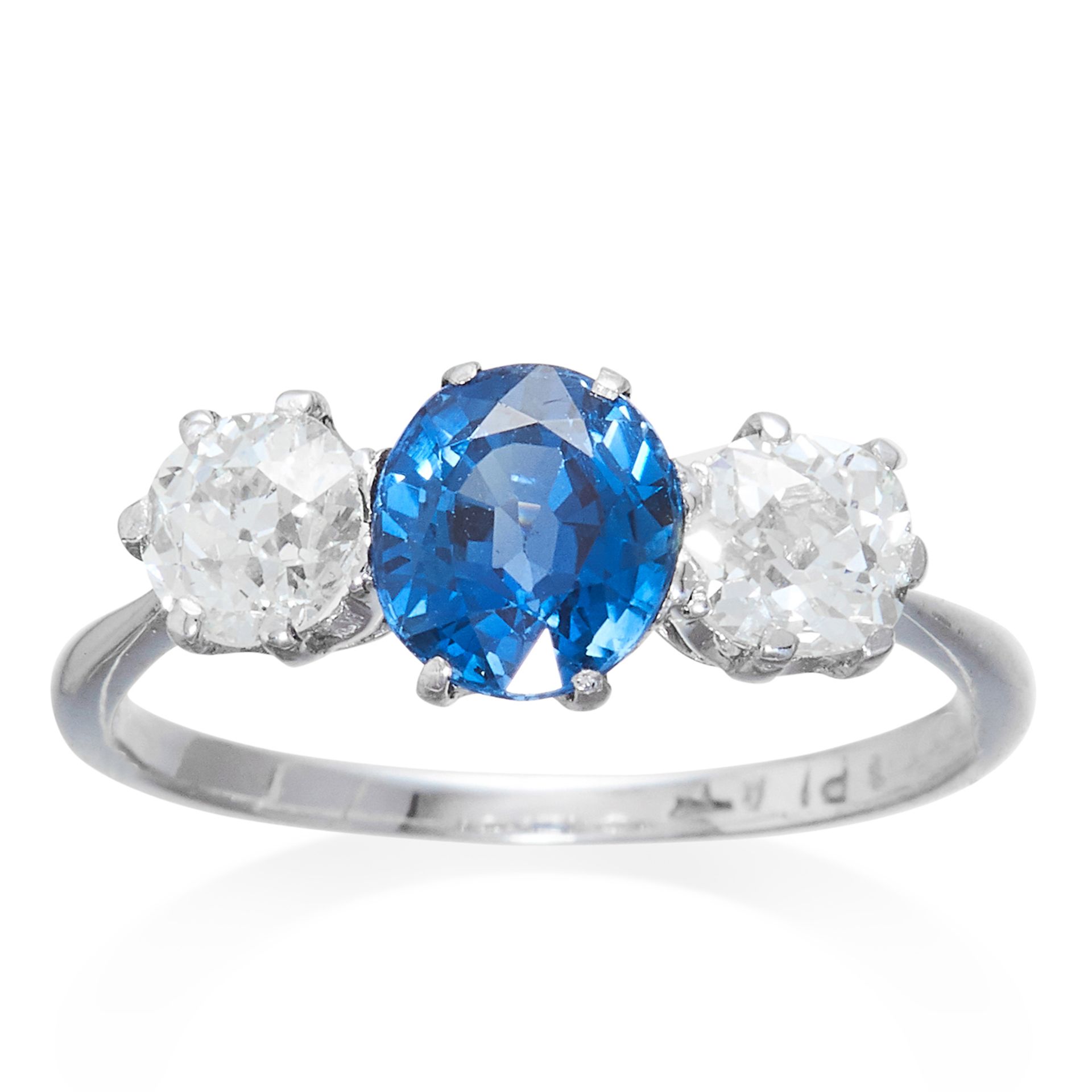 AN ANTIQUE SAPPHIRE AND DIAMOND THREE STONE RING in platinum, the central oval cut sapphire of 1.