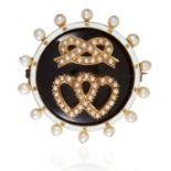 AN ANTIQUE PEARL AND ENAMEL SWEETHEART MOURNING BROOCH in high carat yellow gold, the heart and