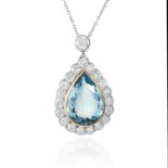 AN AQUAMARINE AND DIAMOND PENDANT in 18ct white gold, set with a pear cut aquamarine of