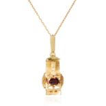 A RUBY AND DIAMOND PENDANT in 18ct yellow gold, the abstract design set with an oval cut ruby and