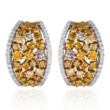 A PAIR OF YELLOW AND WHITE DIAMOND EARRINGS in 18ct white gold, jewelled with round cut yellow and