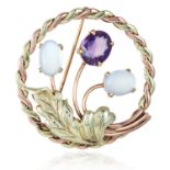 AN AMETHYST AND MOONSTONE BROOCH in 14ct yellow gold, in circular and foliate design jewelled with