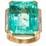 A 34.90ct COLOMBIAN EMERALD RING in high carat yellow gold. designed as a large emerald cut