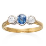 AN ANTIQUE SAPPHIRE AND DIAMOND THREE STONE RING in 18ct gold, the oval cut blue sapphire between