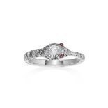 A DIAMOND AND RUBY SNAKE RING in platinum, designed as a snake, jewelled all over with round and