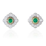 A PAIR OF EMERALD AND DIAMOND CLUSTER EARRINGS in 18ct white gold, each set with a central round cut