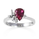 A RUBELLITE AND DIAMOND RING in 18ct white gold, jewelled with a pear cut rubellite and three