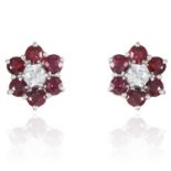 A PAIR OF RUBY AND DIAMOND CLUSTER EARRINGS in yellow gold, jewelled with a round cut diamond in a