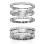 A TRIO OF DIAMOND ETERNITY RINGS, TIFFANY & CO in platinum, the central classic wedding band between