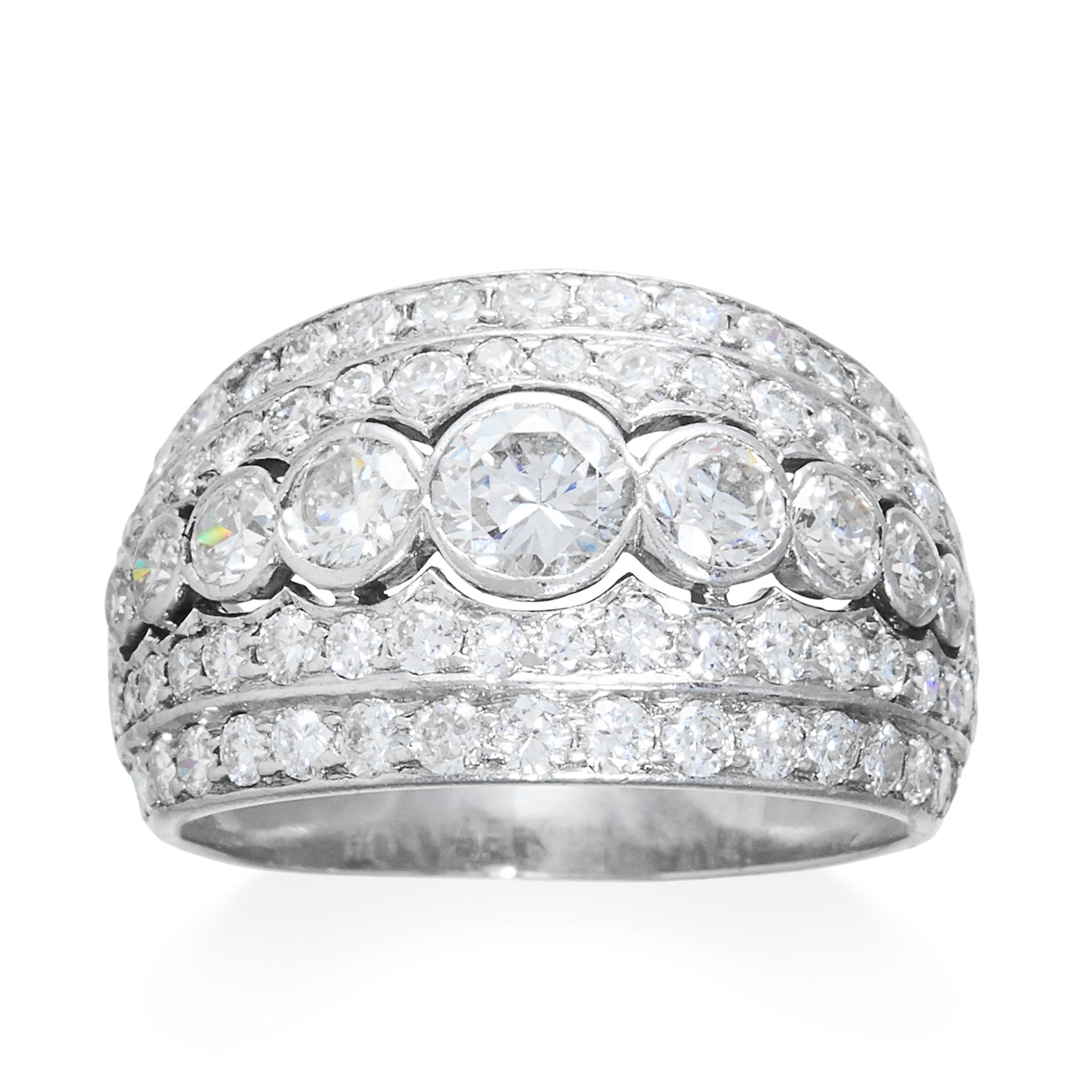 A DIAMOND DRESS RING in platinum, set with five rows of graduated round cut stones, French marks,