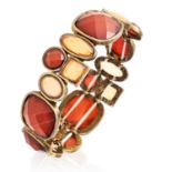 A FACETED HARDSTONE BRACELET formed of various links set with amber and yellow faceted gems,