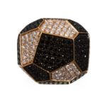 A BLACK AND WHITE DIAMOND RING in 18ct rose gold, the geometric design jewelled with black and white