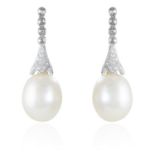 A PAIR OF PEARL AND DIAMOND EARRINGS in 18ct white gold, jewelled with rose cut and round cut