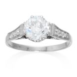 AN ANTIQUE 1.50 CARAT DIAMOND RING in platinum, 1.42 carat central old cut diamond, further diamonds