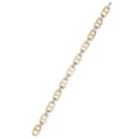 A FANCY LINK BRACELET in 18ct yellow gold and platinum, comprising of eleven gold fancy links and