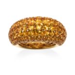 A YELLOW SAPPHIRE DRESS RING in 18ct yellow gold, bombe form, jewelled with round cut yellow