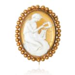 AN ANTIQUE CAMEO BROOCH in high carat yellow gold, depicting Grecian figure, unmarked, 3.6cm, 10.