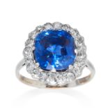 AN UNHEATED 5.82 CARAT SAPPHIRE AND DIAMOND RING in platinum or white gold, the cushion cut blue