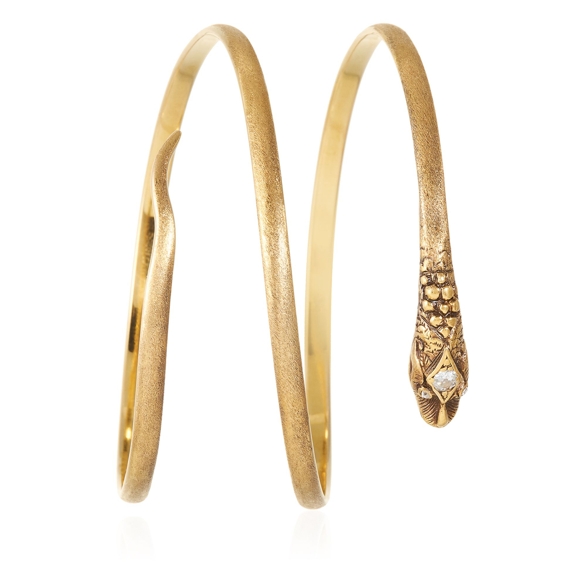 A DIAMOND SNAKE BANGLE in high carat yellow gold, depicting a snake with diamond jewelled head,