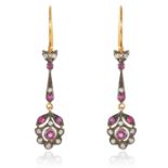 A PAIR OF RUBY AND DIAMOND EARRINGS in gold and silver, each cluster suspended below a jewelled
