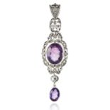 AN ANTIQUE AMETHYST AND DIAMOND PENDANT in silver, oval cut amethysts accented by diamonds within