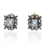 A PAIR OF AQUAMARINE AND DIAMOND EARRINGS in yellow gold and silver, the step cut aquamarines within