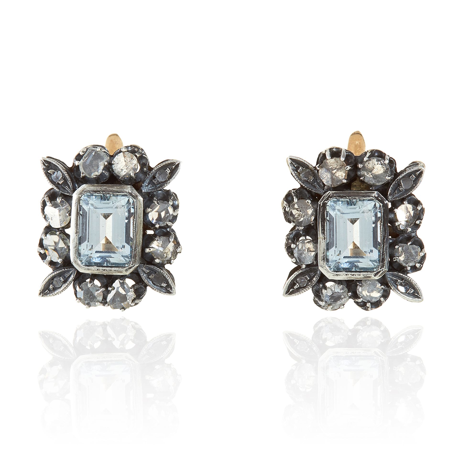 A PAIR OF AQUAMARINE AND DIAMOND EARRINGS in yellow gold and silver, the step cut aquamarines within