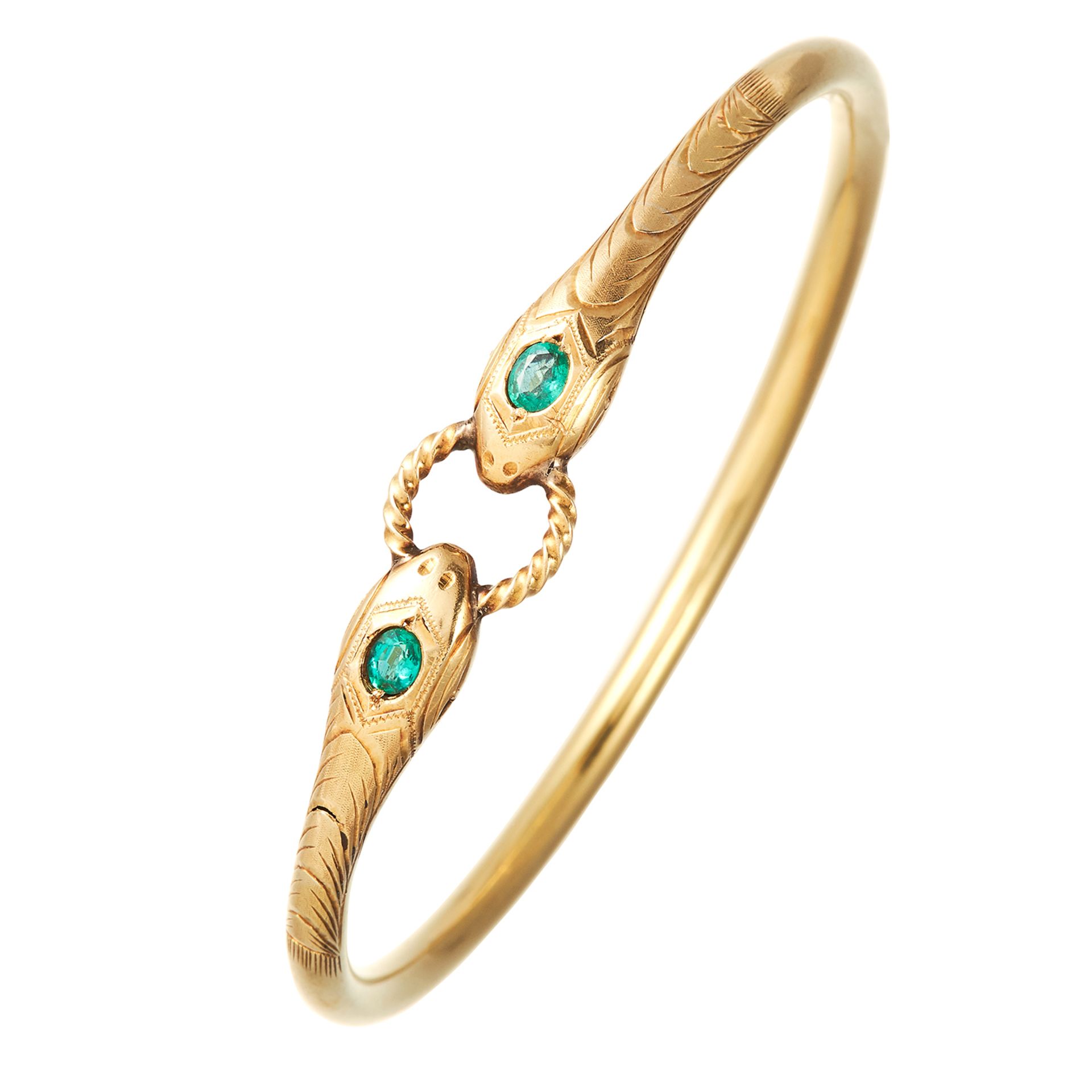 AN ANTIQUE EMERALD SNAKE BANGLE, 19TH CENTURY in high carat yellow gold, the snakes' heads
