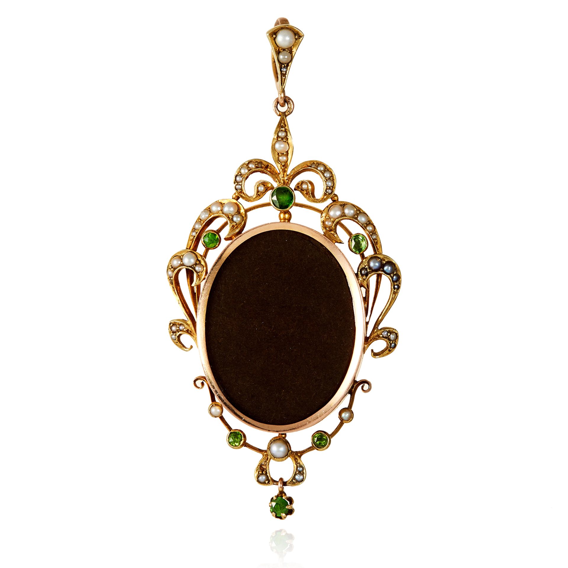 A PEARL AND PERIDOT PENDANT, EDWARDIAN in high carat yellow gold, with locket frame in scrolling