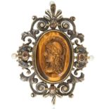 AN ANTIQUE JEWELLED CARVED CAMEO BROOCH, 19TH CENTURY in silver, the tiger's eye carved cameo
